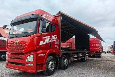 二手青岛解放 JH6重卡 290马力 6X2 9.5米翼开启厢式载货车(国五) 前四后四 锡柴二手载货车 黄牌