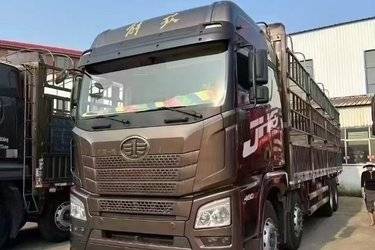 二手青岛解放 JH6重卡 460马力 8X4 9.5米仓栅式载货车(国五) 前四后八 锡柴二手载货车 黄牌图片