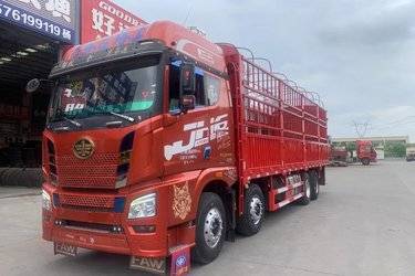 二手青岛解放 JH6重卡 460马力 8X4 9.4米仓栅式载货车(国五) 前四后八 锡柴二手载货车 黄牌图片
