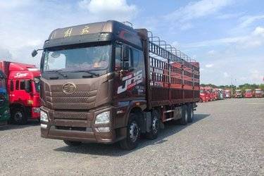 二手青岛解放 JH6重卡 350马力 8X4 9.5米仓栅式载货车(国五) 前四后八 锡柴二手载货车 黄牌图片