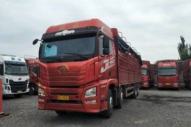 二手青岛解放 JH6重卡 领航版 400马力 8X4 9.5米仓栅式载货车(国五) 前四后八 潍柴二手载货车 黄牌