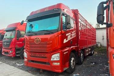 二手青岛解放 JH6重卡 领航版2.0 460马力 8X4 9.4米仓栅式载货车(国六) 前四后八 锡柴二手载货车 黄牌图片