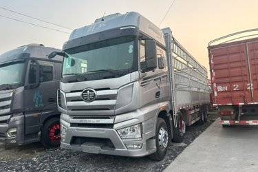 二手一汽解放 J7重卡 经典版 460马力 8X4 9.4米仓栅式载货车(国六) 前四后八 锡柴二手载货车 黄牌图片