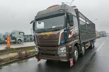 二手青岛解放 JH6重卡 460马力 8X4 9.5米仓栅式载货车(国五) 前四后八 锡柴二手载货车 黄牌