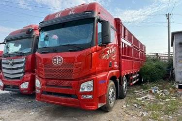 二手青岛解放 JH6重卡 领航版2.0 350马力 8X2 9.5米仓栅式载货车(国六) 前四后六 锡柴二手载货车 黄牌图片