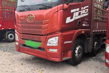 二手青岛解放 JH6重卡 350马力 8X4 9.5米仓栅式载货车(国五) 前四后八 锡柴二手载货车 黄牌