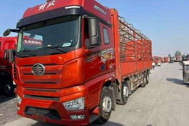 二手一汽解放 J7重卡 经典版 460马力 8X4 9.4米仓栅式载货车(国六) 前四后八 锡柴二手载货车 黄牌图片
