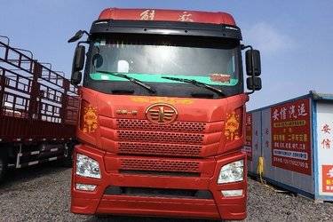 二手青岛解放 JH6重卡 350马力 8X4 9.5米仓栅式载货车(国五) 前四后八 潍柴二手载货车 黄牌图片