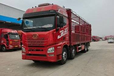 二手青岛解放 JH6重卡 420马力 8X4 9.5米仓栅式载货车(国五) 前四后八 锡柴二手载货车 黄牌图片