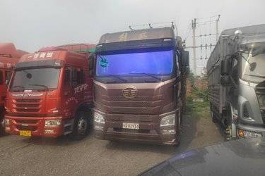 二手青岛解放 JH6重卡 290马力 6X2 9.5米仓栅式载货车(国六) 前四后四 锡柴二手载货车 黄牌