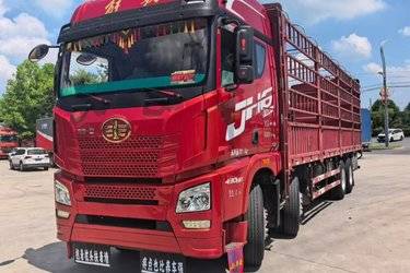 二手青岛解放 JH6重卡 430马力 8X4 9.5米仓栅式载货车(国五) 前四后八 潍柴二手载货车 黄牌