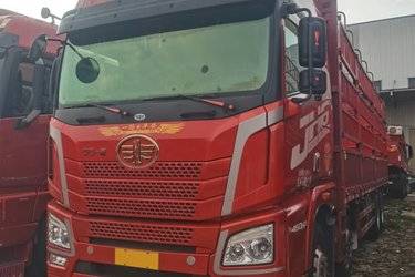 二手青岛解放 JH6重卡 460马力 8X4 9.5米仓栅式载货车(国五) 前四后八 锡柴二手载货车 黄牌图片
