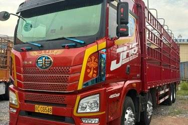 二手青岛解放 JH6重卡 460马力 8X4 9.5米仓栅式载货车(国五) 前四后八 锡柴二手载货车 黄牌图片
