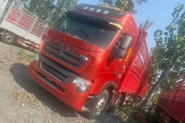 二手中国重汽 HOWO T7H重卡 440马力 8X4 9.5米仓栅式载货车(国五) 前四后八 曼二手载货车 黄牌图片