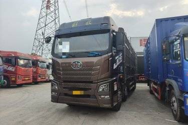 二手青岛解放 JH6重卡 460马力 8X4 9.5米仓栅式载货车(速比4.111)(国五) 前四后八 锡柴二手载货车 黄牌图片