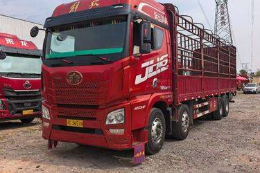 二手青岛解放 JH6重卡 460马力 8X4 9.4米仓栅式载货车(国五) 前四后八 锡柴二手载货车 黄牌图片