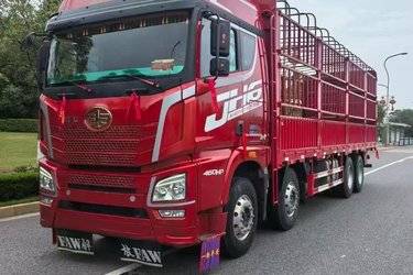 二手青岛解放 JH6重卡 460马力 8X4 9.4米仓栅式载货车(国五) 前四后八 锡柴二手载货车 黄牌图片