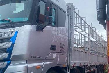 二手福田 欧曼EST 6系重卡 西南版 460马力 8X4 9.45米仓栅式载货车(国五) 前四后八 康明斯二手载货车 黄牌图片