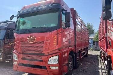 二手青岛解放 JH6重卡 320马力 6X2 9.5米仓栅式载货车(国六) 前四后四 锡柴二手载货车 黄牌