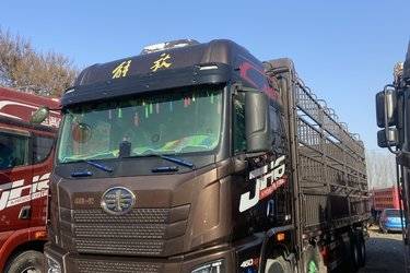 二手青岛解放 JH6 智享版 460马力 8X4 9.5米AMT自动档仓栅式载货车(国六) 前四后八 锡柴二手载货车 黄牌图片