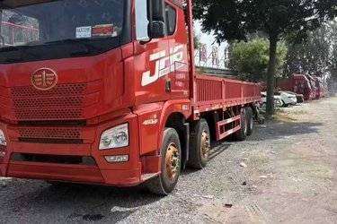 二手青岛解放 JH6重卡 领航版2.0 460马力 8X4 9.4米栏板载货车(国六) 单桥 锡柴二手载货车 黄牌