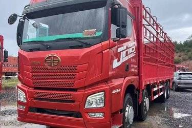 二手青岛解放 JH6重卡 460马力 8X4 9.4米仓栅式载货车(国五) 前四后八 锡柴二手载货车 黄牌图片