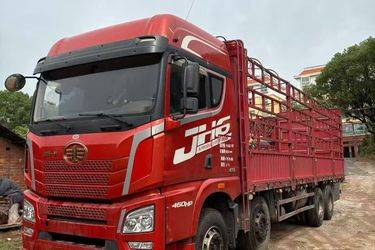 二手青岛解放 JH6重卡 460马力 8X4 9.4米仓栅式载货车(国五) 前四后八 锡柴二手载货车 黄牌图片