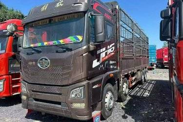 二手青岛解放 JH6重卡 领航版2.0 460马力 8X4 9.4米仓栅式载货车(国六) 前四后八 锡柴二手载货车 黄牌图片