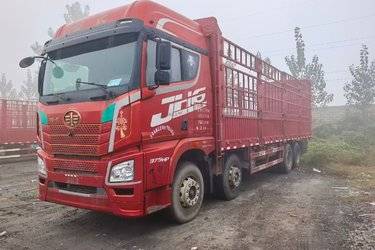 二手青岛解放 JH6重卡 375马力 8X4 9.5米仓栅式载货车(国五) 前四后八 潍柴二手载货车 黄牌图片