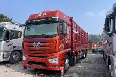 二手一汽解放 J7重卡 460马力 8X4 9.5米仓栅式载货车(国六) 前四后八 锡柴二手载货车 黄牌图片