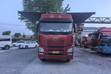 二手青岛解放 JH6重卡 460马力 8X4 9.5米翼开启厢式货车(国五) 前四后八 锡柴二手载货车 黄牌图片