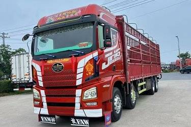 二手青岛解放 JH6重卡 460马力 8X4 9.4米仓栅式载货车(国五) 前四后八 锡柴二手载货车 黄牌图片