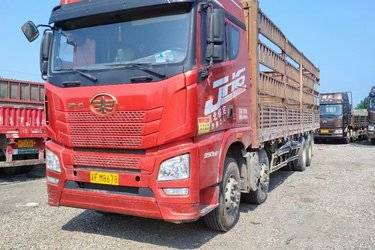 二手青岛解放 JH6重卡 350马力 8X4 9.5米仓栅式载货车(国五) 前四后八 锡柴二手载货车 黄牌图片