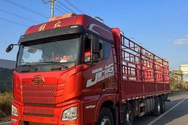 二手青岛解放 JH6重卡 350马力 8X4 9.4米仓栅式载货车(国五) 前四后八 潍柴二手载货车 黄牌