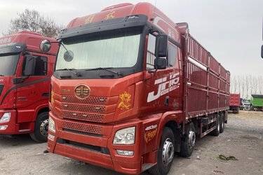 二手青岛解放 JH6重卡 460马力 8X4 9.5米仓栅式载货车(速比3.545)(国五) 前四后八 锡柴二手载货车 黄牌