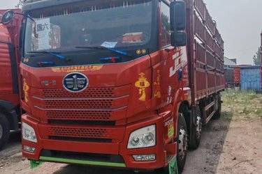 二手青岛解放 JH6重卡 320马力 6X2 9.5米仓栅式载货车(国六) 前四后四 锡柴二手载货车 黄牌图片