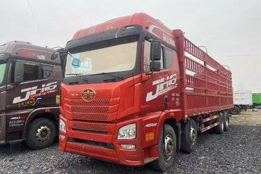 二手青岛解放 JH6重卡 领航版2.0 460马力 8X4 9.5米仓栅式载货车(国六) 前四后八 锡柴二手载货车 黄牌