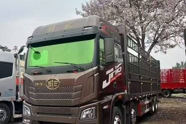 二手青岛解放 JH6重卡 智尊版2.0 460马力 8X4 9.4米仓栅式载货车(国六) 前四后八 锡柴二手载货车 黄牌图片