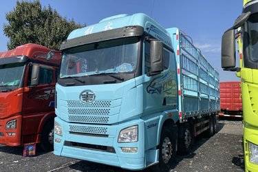 二手青岛解放 JH6 智享版 520马力 8X4 9.5米AMT自动档仓栅式载货车(国六) 前四后八 锡柴二手载货车 黄牌