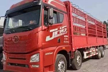 二手青岛解放 JH6重卡 350马力 8X4 9.4米仓栅式载货车(国五) 前四后八 锡柴二手载货车 黄牌