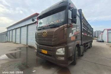 二手青岛解放 JH6重卡 350马力 8X4 9.4米仓栅式载货车(国五) 前四后八 锡柴二手载货车 黄牌