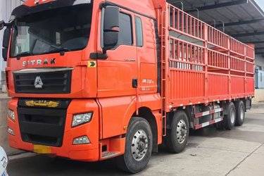 二手中国重汽 汕德卡SITRAK C7H重卡 440马力 8X4 9.52米仓栅式载货车(国五) 前四后八 中国重汽二手载货车 黄牌图片