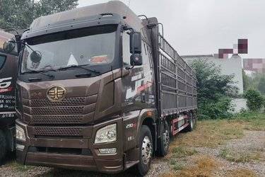 二手青岛解放 JH6重卡 290马力 6X2 9.5米仓栅式载货车(国六) 前四后四 锡柴二手载货车 黄牌