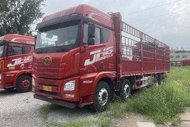 二手青岛解放 JH6重卡 350马力 8X4 9.5米仓栅式载货车(国五) 前四后八 锡柴二手载货车 黄牌