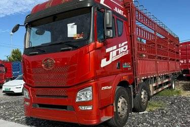 二手青岛解放 JH6重卡 290马力 6X2 9.5米仓栅式载货车(国六) 前四后四 锡柴二手载货车 黄牌