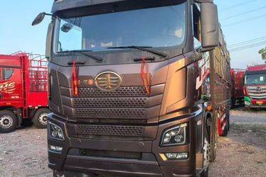 二手青岛解放 JH6重卡 460马力 8X4 9.4米仓栅式载货车(国五) 前四后八 潍柴二手载货车 黄牌图片