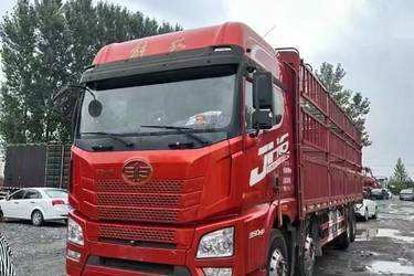 二手青岛解放 JH6重卡 350马力 8X4 9.5米仓栅式载货车(国五) 前四后八 锡柴二手载货车 黄牌