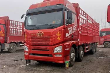 二手青岛解放 JH6重卡 400马力 8X4 9.5米仓栅式载货车(国五) 前四后八 潍柴二手载货车 黄牌图片