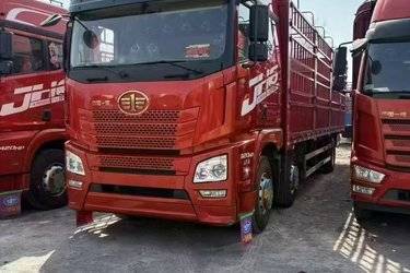 二手青岛解放 JH6重卡 320马力 6X2 9.5米仓栅式载货车(国六) 前四后四 锡柴二手载货车 黄牌