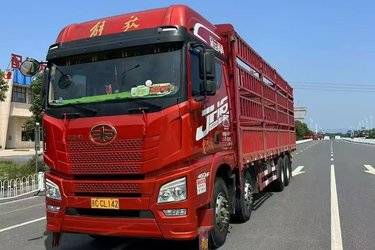 二手青岛解放 JH6重卡 领航版2.0 460马力 8X4 9.4米仓栅式载货车(国五) 前四后八 潍柴二手载货车 黄牌